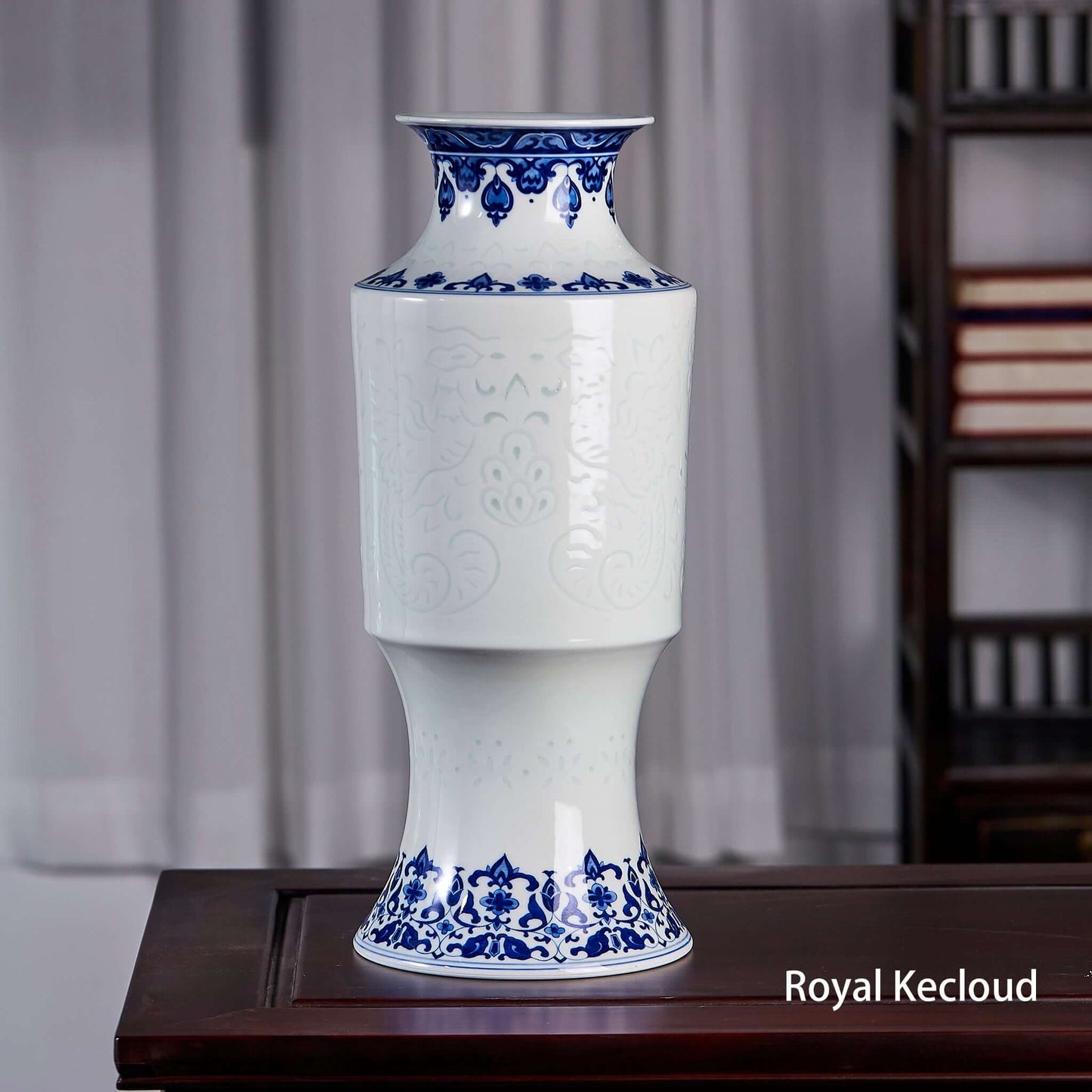 Blue & White Porcelain Vase showcasing elegant floral motifs and a unique phoenix-tail shape.