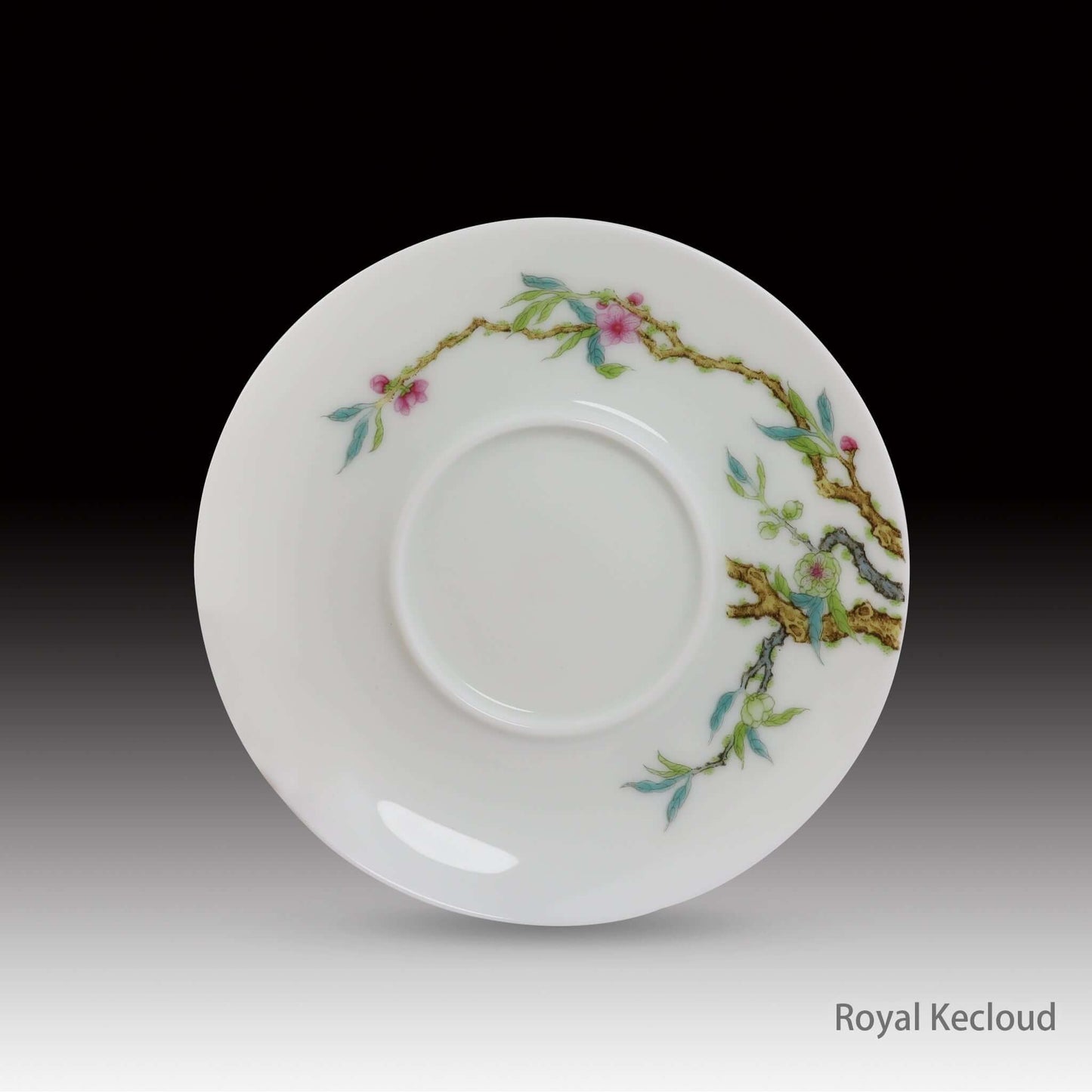 Chinese Ceramics cup and saucer featuring intricate floral designs and traditional motifs.