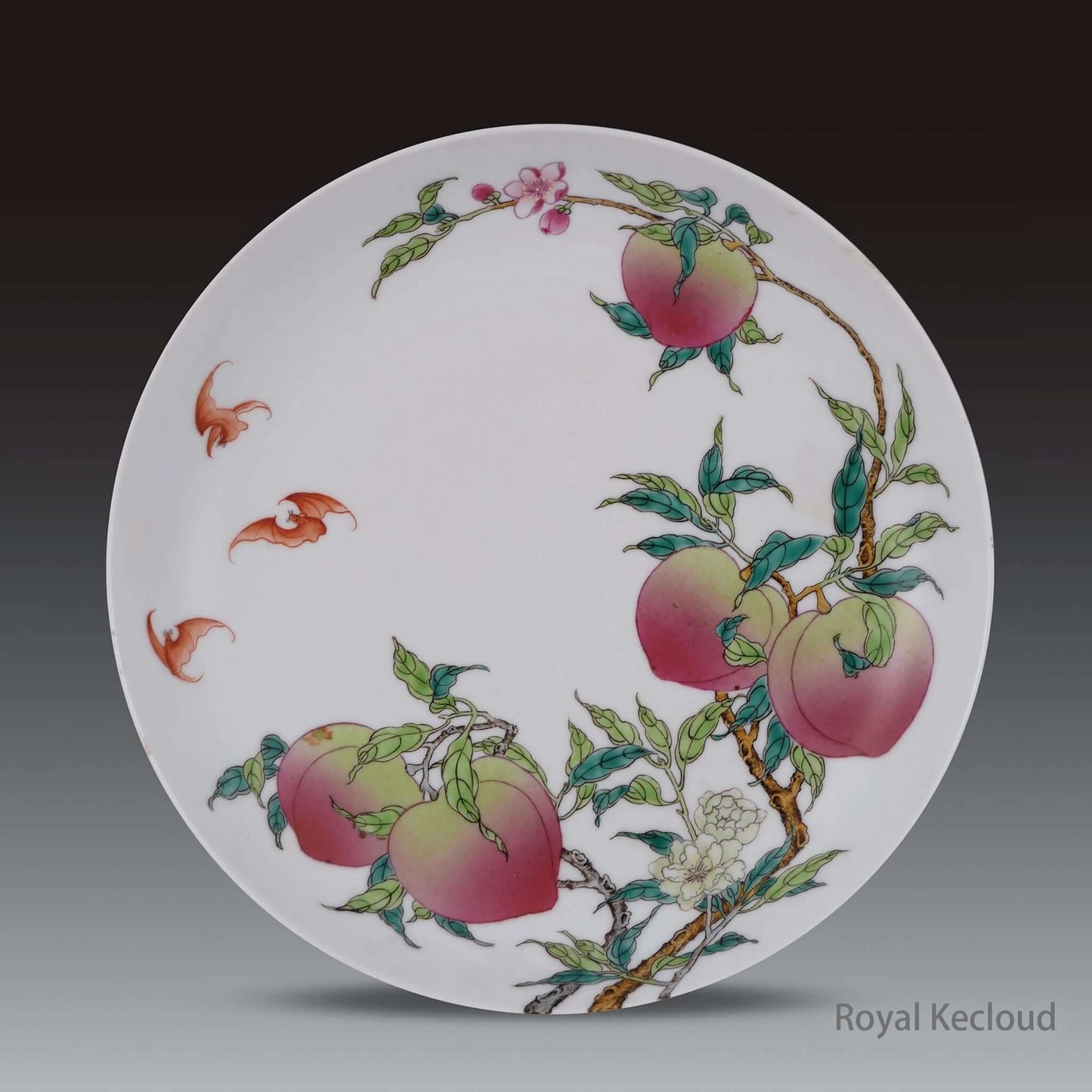 Famille Rose Porcelain Dish featuring ripe peaches and bats, symbolizing longevity and fortune from the Qing Dynasty.