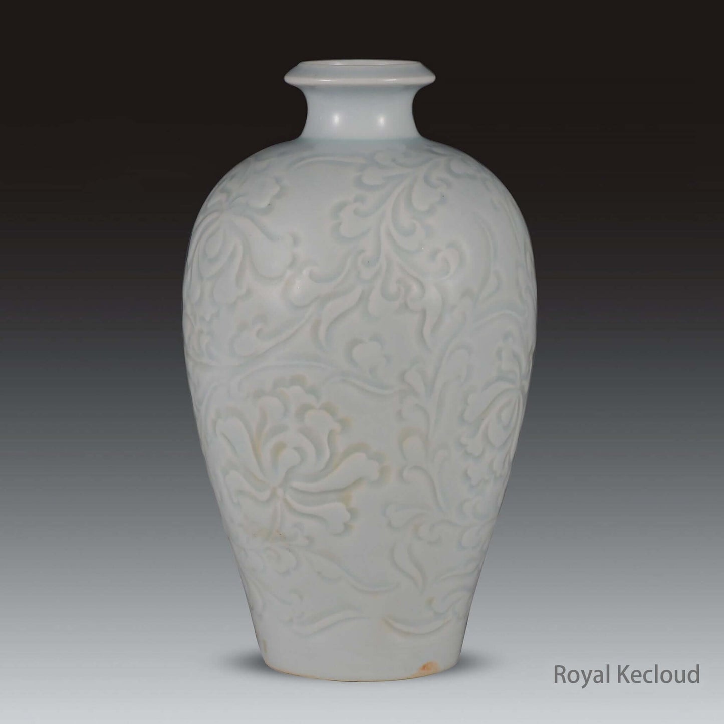 Qingbai Porcelain Vase with carved floral design in soft blue-white glaze, showcasing Song Dynasty artistry.