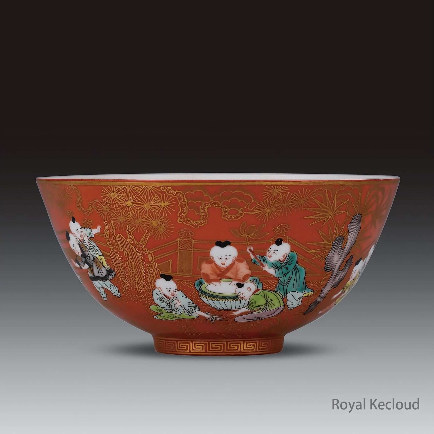 Imperial Ceramic Bowl featuring children at play on a coral-ground Famille Rose design.