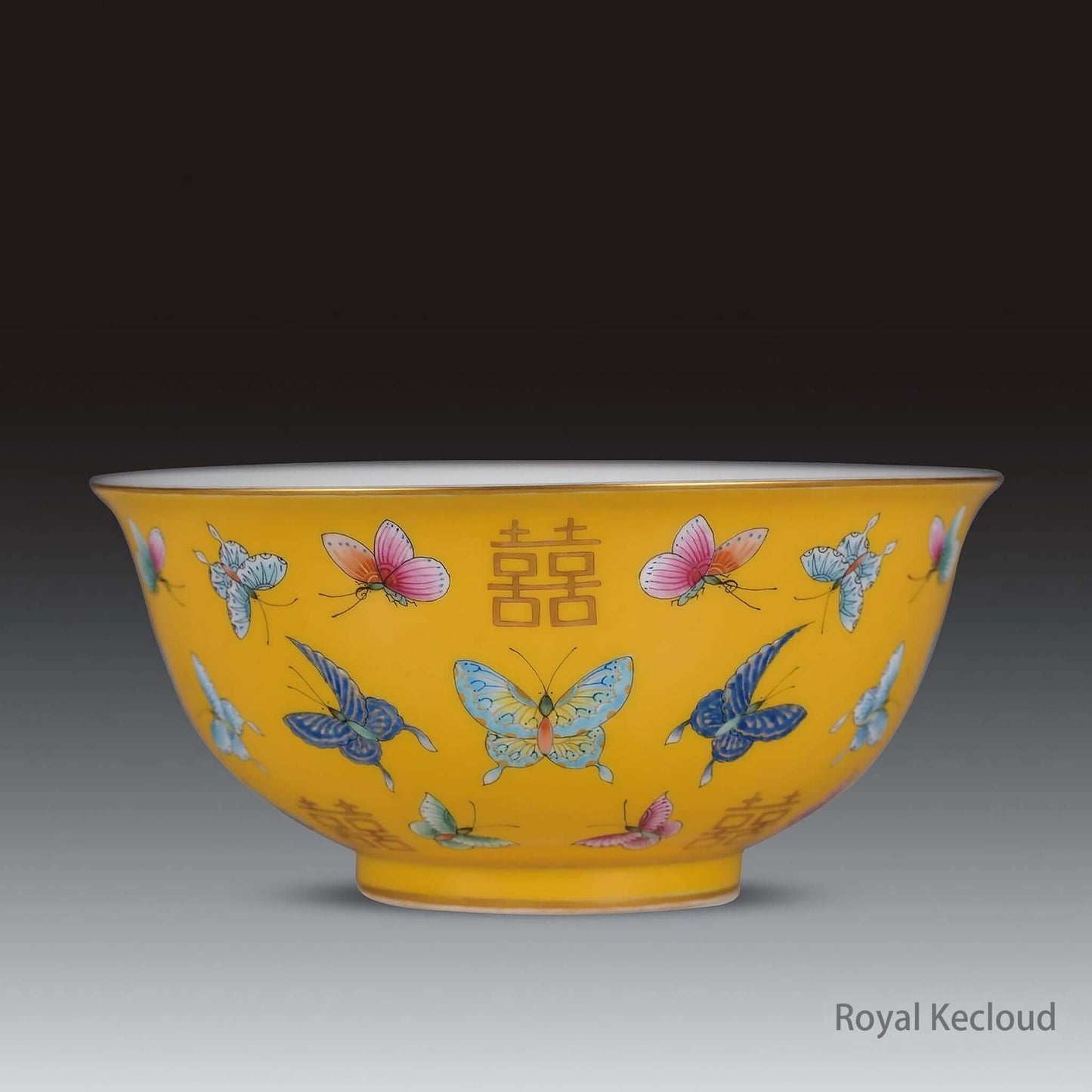 Royal Ceramic Bowl featuring delicate butterflies on luminous yellow ground, Qing Dynasty famille rose design.
