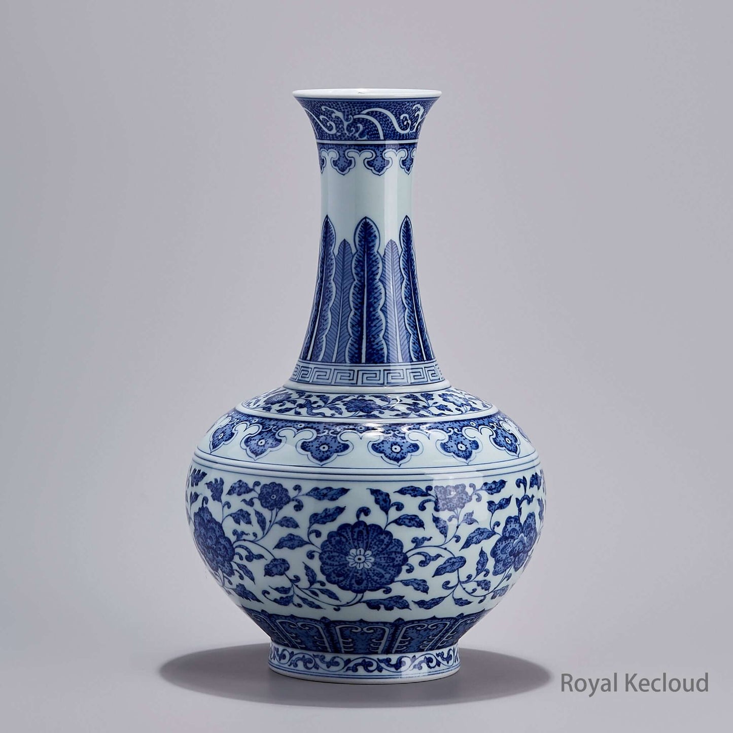 Blue and White Porcelain Vase featuring interlocking lotus patterns, showcasing Qing Dynasty craftsmanship.