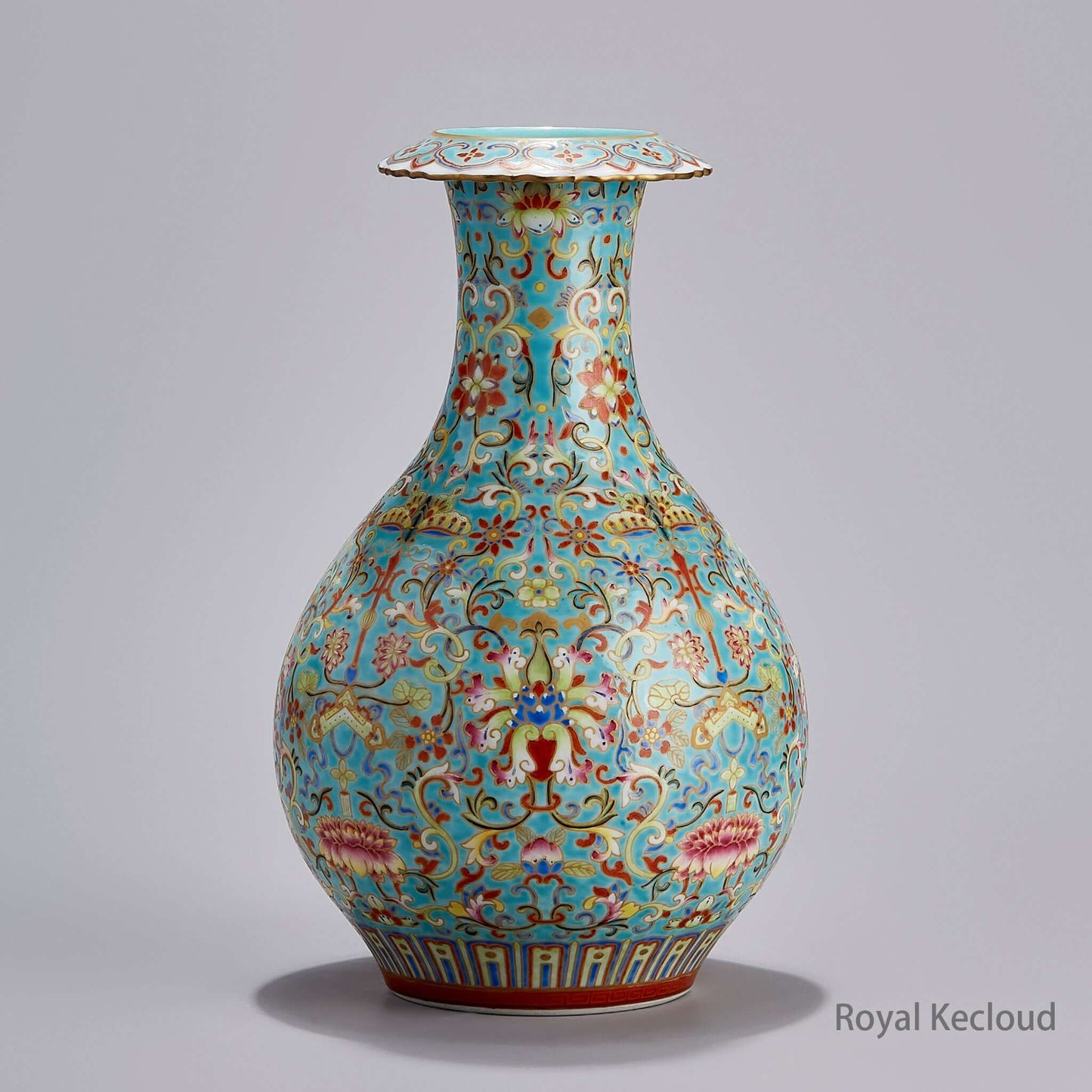 Turquoise-Ground Famille Rose Porcelain Vase featuring intricate floral designs and a vibrant glaze, showcasing Qing Dynasty craftsmanship.