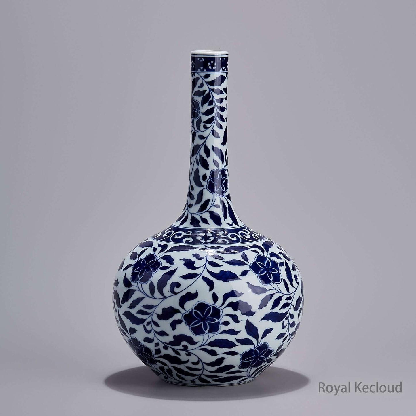 Blue and White Globular Vase showcasing intricate lotus design in cobalt blue and white, reflecting Qing Dynasty craftsmanship.