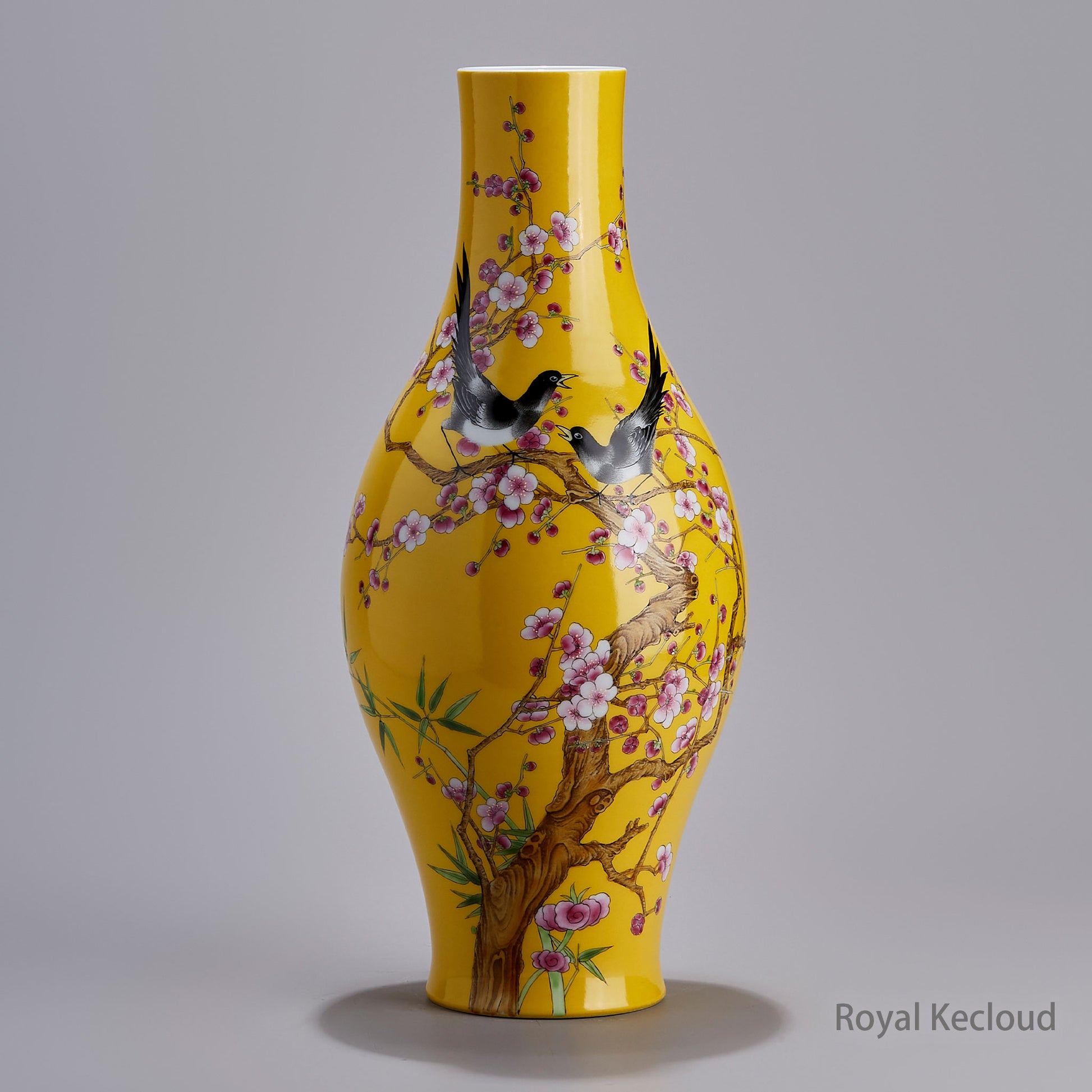 A Famille Rose Olive-Shaped Porcelain Vase with Prunus and Magpies Design on a Yellow Ground