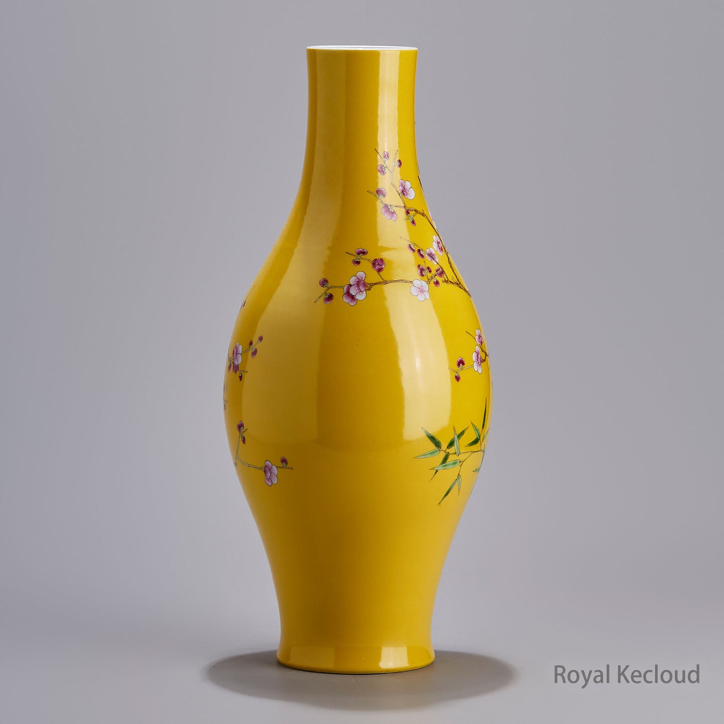 A Famille Rose Olive-Shaped Porcelain Vase with Prunus and Magpies Design on a Yellow Ground